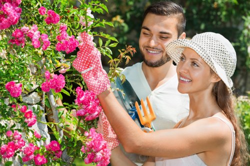 Gardener performing seasonal maintenance in a Battersea garden