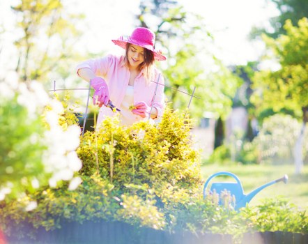 Crew member inspecting a lawn to assess a complaint about mowing